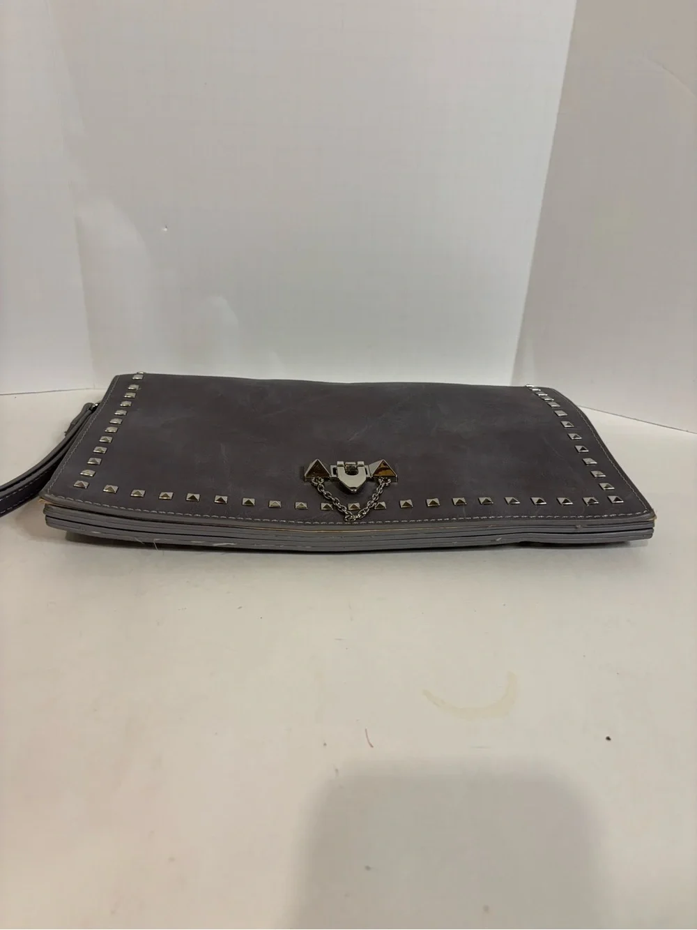 Stud-Trim Gray Wristlet Clutch